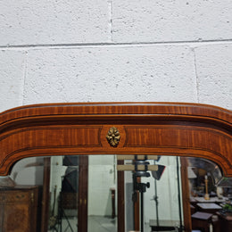Decorative late 19th Century mahogany French wall mirror with brass swivel candle holders and brass detail. In good original detailed condition.