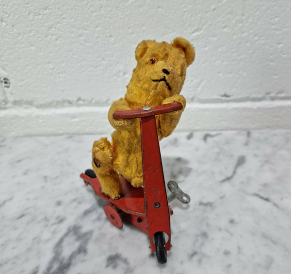 "Gebruder Fendi" bear riding scooter wind up toy, comes with original key. In good original condition, please view photos as they help form part of the description.