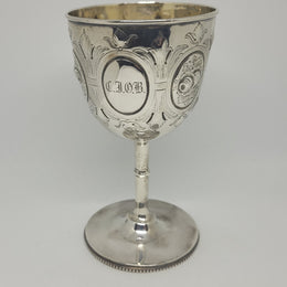Unique Sterling Silver Christening Goblet With Repousse Motifs. Sheffield 1891. In very good original condition. Initials CJOB on one panel.