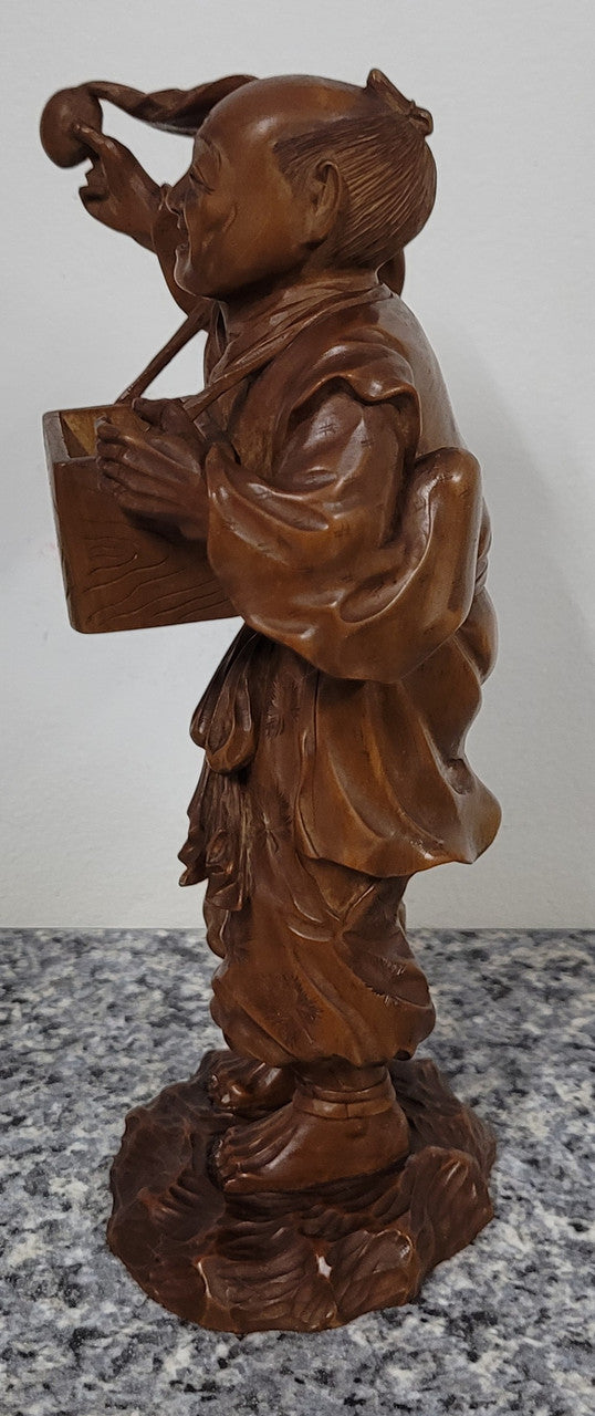 Exceptional Japanese Meiji period boxwood carving of a Peach Seller. Circa 1880's and it is signed to base. It is in good original condition, please view photos as they help form part of the description.