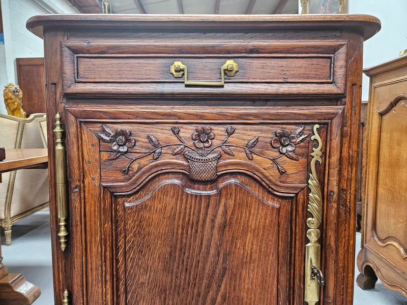 Louis 15th style oak 19th century cabinet with lovely brass hinges, handles & charming carving.  Circ: 1860's. In good original condition.
