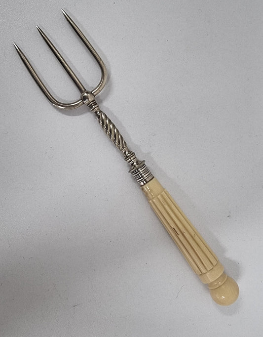 Elegant Antique pickle fork with a ivory handle. It is in good original condition, please view photos as they help form part of the description.
