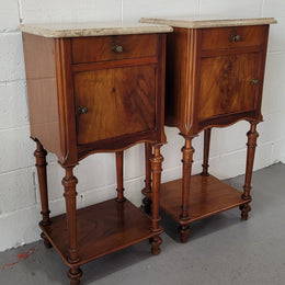 Pair of Louis XVI style walnut bedsides with attractive marble. They have one drawer, one cupboard and are in good original detailed condition.