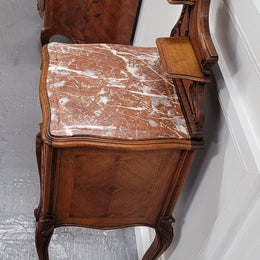 French Louis XV style Walnut single bedside cupboard with inset marble top. It has been sourced from France and is in good original detailed condition.