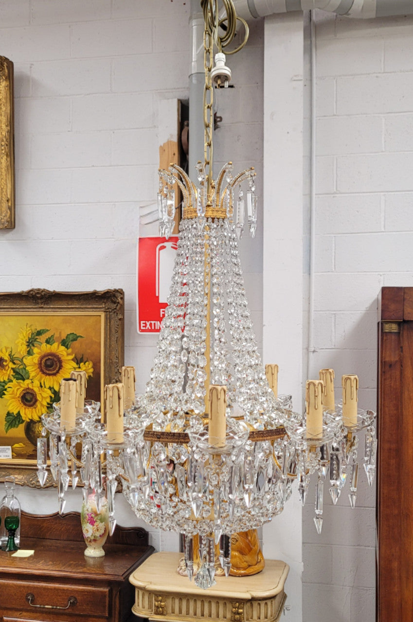 Fine French Empire basket shaped crystal chandelier. Consisting of ten exterior arms and four interior lights. It has stunning crystal's with prism drops. It has been sourced from France fully rewired to Australian standards.