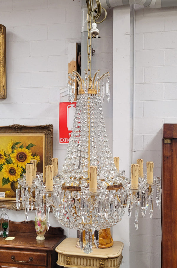 Fine French Empire basket shaped crystal chandelier. Consisting of ten exterior arms and four interior lights. It has stunning crystal's with prism drops. It has been sourced from France fully rewired to Australian standards.