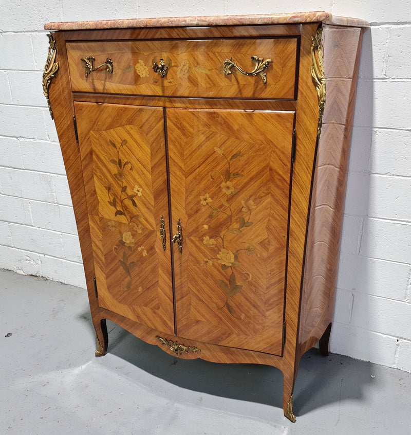 French Louis XV style marquetry inlaid marble top side cabinet. It has one drawer at the top and two doors open up to two adjustable shelves. It has beautiful coloured marble and decorative mounts. In good original detailed condition.