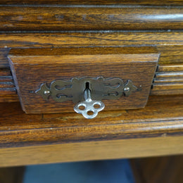 An Antique American Oak Cutler Roll Top Desk