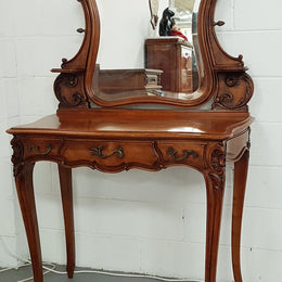 French walnut Antique Louis XV style dressing table of petite size, retaining it's original bevelled edge tilt mirror. In good original condition with three small drawers. Circa 1900.