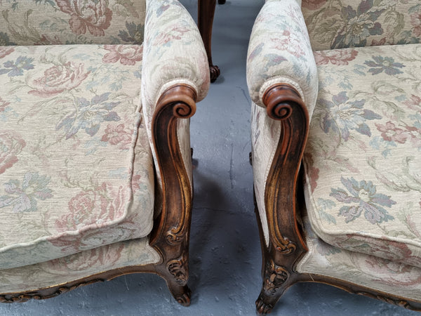Lovely French pair of gilt and floral upholstered Bergere chairs with beautiful decorative carving in good original detailed condition.
