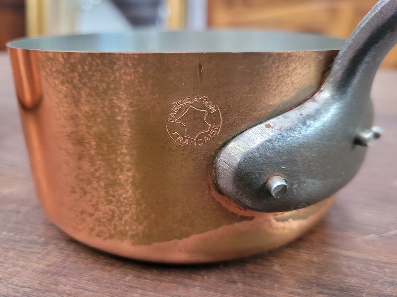 Set of five copper sauce pans with foundry stamp. They have been sourced from France and are in good original detailed condition.