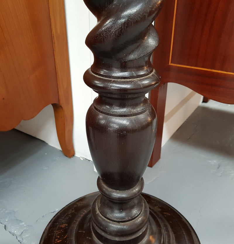 A Victorian round walnut barley twist pedestal/planter and in good original condition.