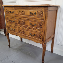 French Oak Louis 15th style nicely carved three drawer wooden top commode. It has been sourced from France and is in good original detailed condition.
