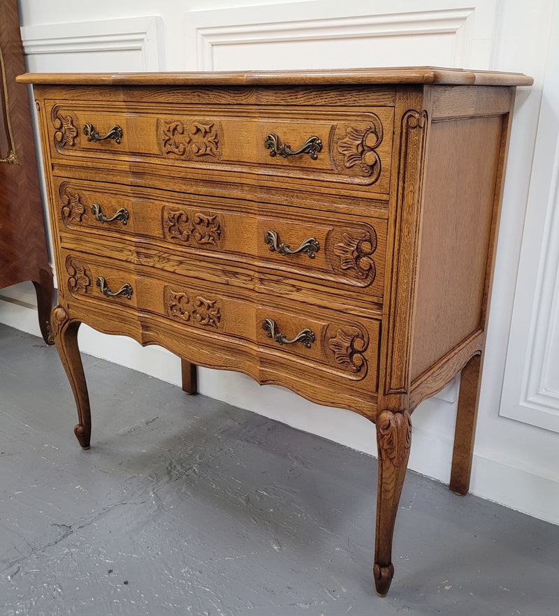 French Oak Louis 15th style nicely carved three drawer wooden top commode. It has been sourced from France and is in good original detailed condition.