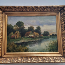 Lovely framed original oil on canvas of a country cottage scene on a river in good original condition