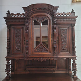 Spectacular French Antique Walnut Renaissance Style buffet with amazing detailed carvings. Plenty of storage space with five cupboards and two large drawers. The three top cupboards open up to two adjustable shelves in each section and the two bottom drawers open up to one large fully adjustable shelve. In good original detailed condition. Circa 1860.