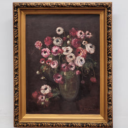 Antique French floral oil on canvas in gilt frame that is signed lower right corner. It has been sourced from France and is in good original detailed condition.