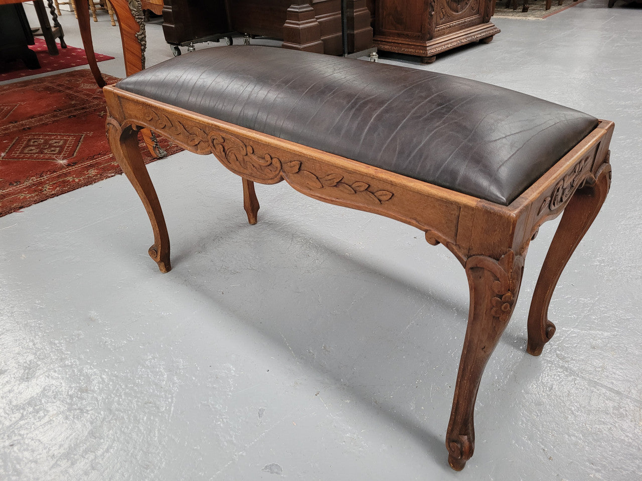 French Oak newly upholstered leather look duet stool. In good original detailed condition and new upholstery.