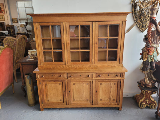 Edwardian Oak dwarf bookcase with six cupboards and three drawers. In very good original detailed condition.