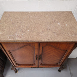 Stunning compact Louis 15th style two door walnut cabinet with ormolu trim and marble top. It is in good original condition.