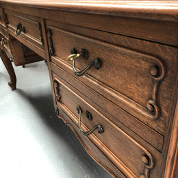 French Oak Louis XV style full partners desk with both sides having five functional drawers. In very good original detailed condition.