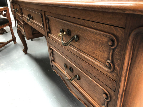 French Oak Louis XV style full partners desk with both sides having five functional drawers. In very good original detailed condition.