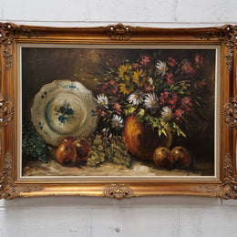 Beautiful signed oil on canvas of a still life framed in an ornate frame. Sourced in France and in good original condition.