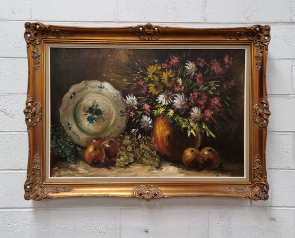 Beautiful signed oil on canvas of a still life framed in an ornate frame. Sourced in France and in good original condition.