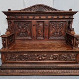 A Sensational 18th Century carved Italian Renaissance style hall seat, with amazing detail. The sit lifts up and inside can be used for storage. There is also two hidden pull out drawers on both sides of the arms (pictured). The detail of the carving is exceptional and very ornate. This amazing piece is in very good original detailed condition.