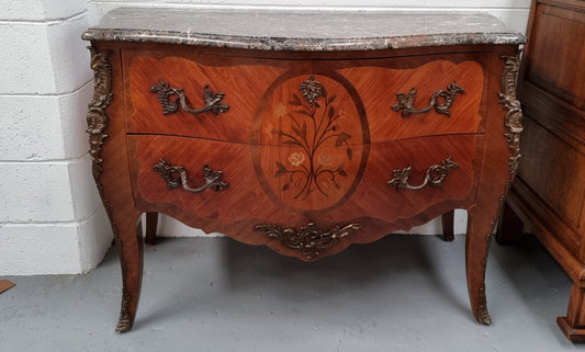 Beautiful French walnut Louis XV style two drawer commode. With a lovely floral marquetry inlaid design and marble top. It is in good original detailed condition.