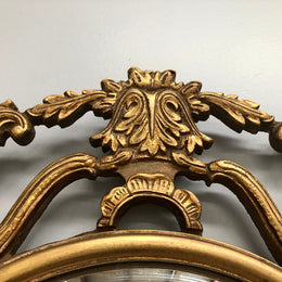French gilt wood round convex mirror. In good original condition.