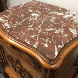 Single French carved bedside with inset marble top. It has beautiful carving and a drawer and cupboard for storage. In very good original detailed condition.