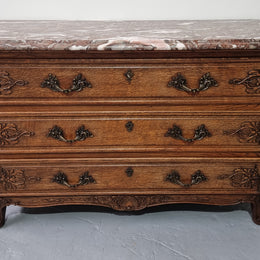 French Louis XV style three drawer Oak marble top commode. In good original detailed condition.