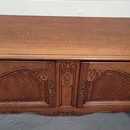 French Oak Louis XV Style two door nicely carved cabinet which would make an ideal TV cabinet. There are two doors for all your storage needs and is a very solid piece. In good original detailed condition.
