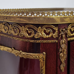 Louis XV style Walnut vitrine display cabinet with attractive ormolu mounts. Beautiful Maroon floral fabric backing with two glass shelves and cabriole legs with decorative ormolu mounts. In good original detailed condition.