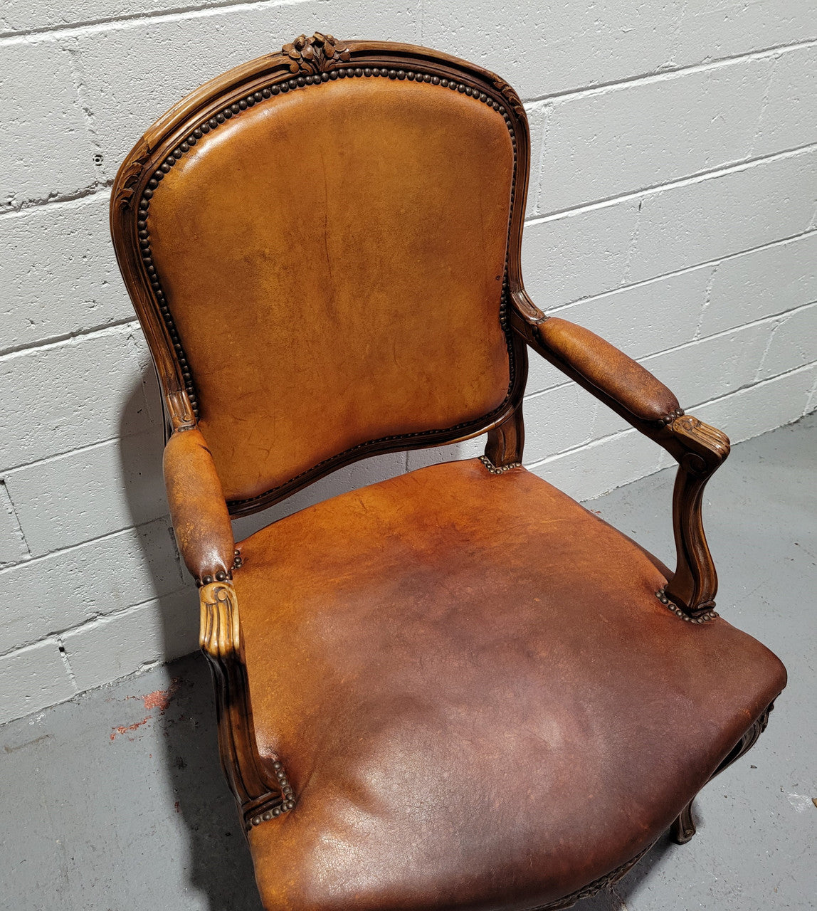 French Walnut Louis XV style desk chair with faux leather upholstery. The upholstery is in good original condition and very comfortable to sit in.