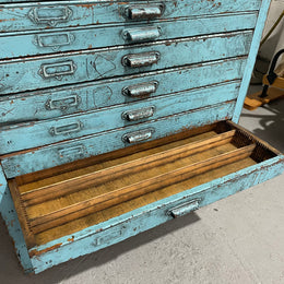 Fabulous set of vintage painted blue printers drawers that have adjustable separators which can be taken out for large papers. The drawers are various sizes and there is a section on top for working on or for storing brushes or tall items . These would be perfect for artists or jewellery pieces or even architects. Such a beautiful piece of industrial furniture.