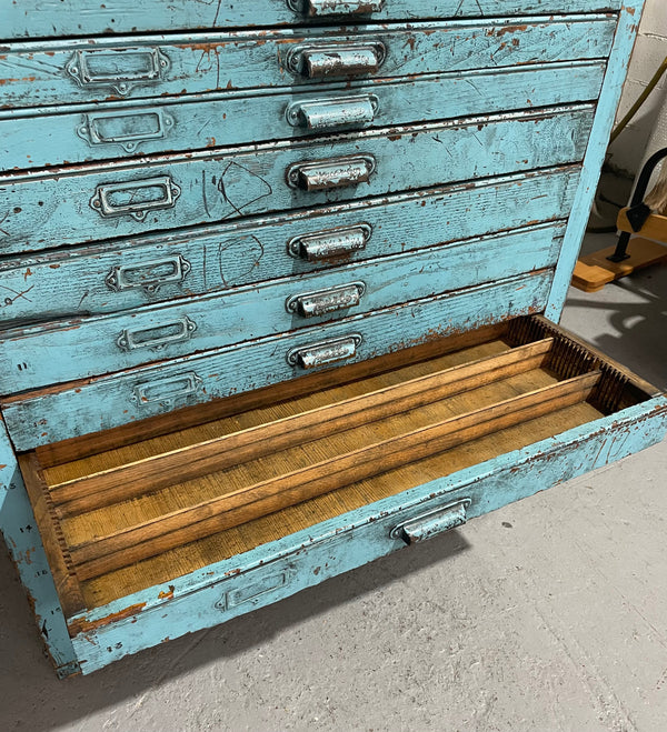 Fabulous set of vintage painted blue printers drawers that have adjustable separators which can be taken out for large papers. The drawers are various sizes and there is a section on top for working on or for storing brushes or tall items . These would be perfect for artists or jewellery pieces or even architects. Such a beautiful piece of industrial furniture.