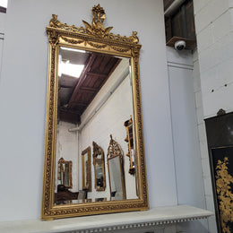 Impressive French Napoleon III water gilded mantle mirror. It is beautifully decorated with allegorical themes and has been sourced from France. In good original detailed condition with original mirror.