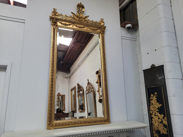 Impressive French Napoleon III water gilded mantle mirror. It is beautifully decorated with allegorical themes and has been sourced from France. In good original detailed condition with original mirror.