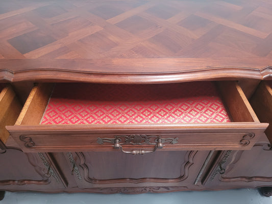 Louis XV style Walnut sideboard with three drawers and three doors. In good original detailed condition.