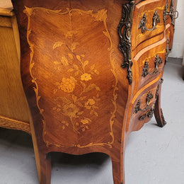 Antique French Louis XV style compact three drawer marble top commode with marquetry inlay and ormolu mounts. Sourced from France and in good original detailed condition.