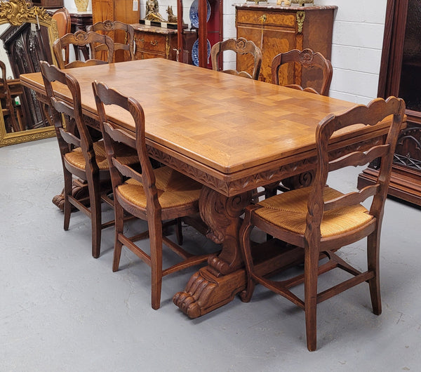 Amazing French Oak Renaissance style parquetry top extension table. Beautiful parquetry top and amazing detailed carvings on the legs. It extends to 306 cm long when fully extended. Sourced from France and in good original detailed condition.