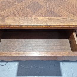 Beautifully carved french oak, faux partners desk with a lovely parquetry top and 6 drawers and 1 cupboard . In good original condition.