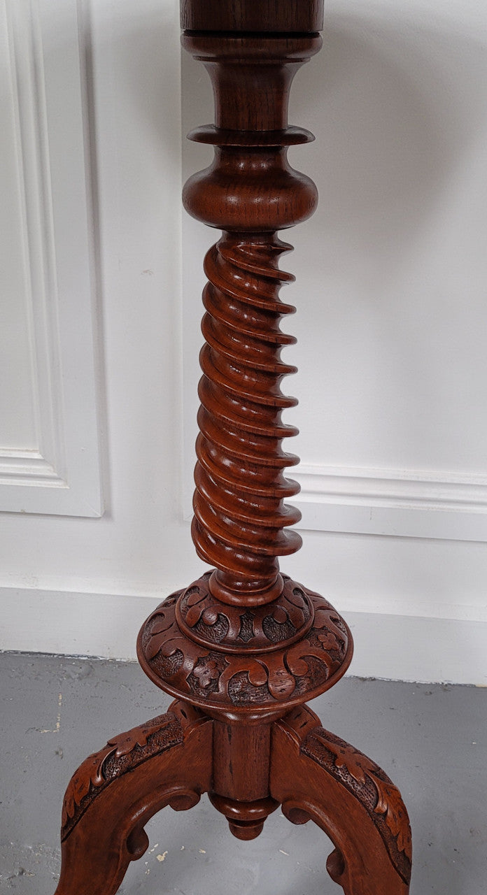 Rare early Victorian Irish Burr Walnut wine table. It has a beautiful carvings and a stunning burr walnut top, on a barley twist column and three shaped legs. It has been sourced locally and is in good original detailed condition. We also have a second table being sold separately which when together make a matched pair.