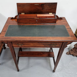 Edwardian Sheraton style desk with a tooled leather insert top with beautiful marquetry inlay. In good original detailed condition. Circa: 1910's