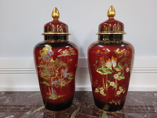 Matched pair of very large Crown Devon hand painted Ruby lustre vases with Lids. They are in good original condition with no chips or cracks.