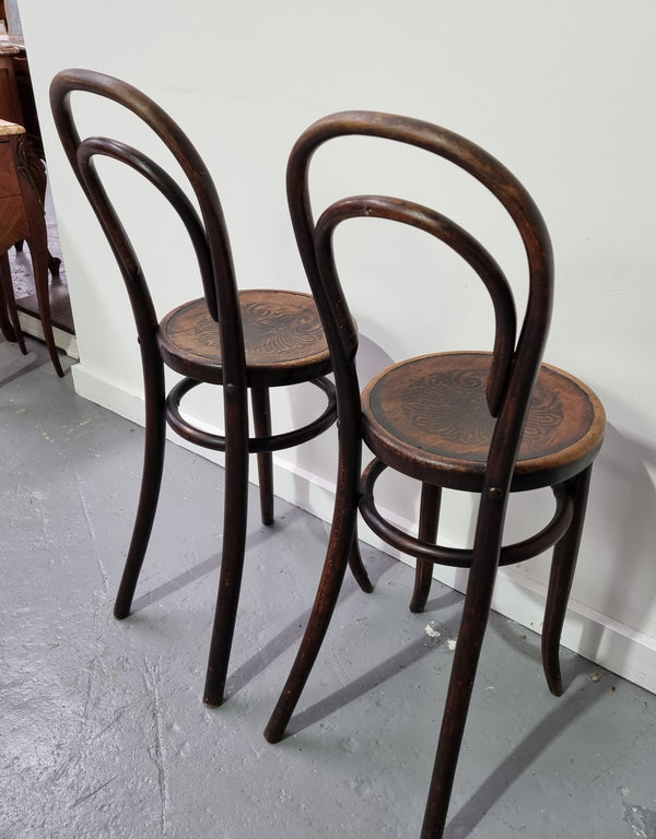 Rare petite cafe Bentwood chairs with original shell embossed seats. They are in very good original condition. They would make great addition to your breakfast bar.