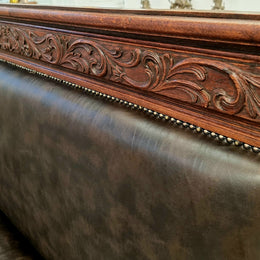 Superbly carved early 19th century newly upholstered French Oak hall seat of grand proportions and lovely details in good condition.