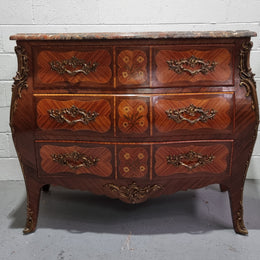 French Walnut and Kingwood Louis XV style marquetry inlaid commode with three drawers and a beautiful marble top. It is in good original detailed condition.